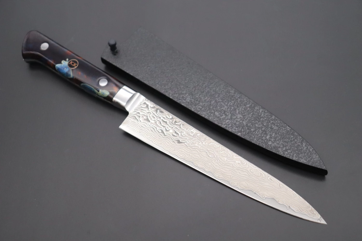 JCK Original Kagayaki NOVEL- Limited Edition Custom R-2 Damascus Series KNLTD-99 Petty 150mm (5.9 Inch, Hammer Forged Blade) 1 JCK Original Kagayaki NOVEL- Limited Edition Custom R-2 Damascus Series KNLTD-99 Petty 150mm (5.9 Inch, Hammer Forged Blade)